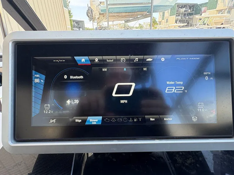 Slide: The Image of Dashboard of 2021 Yamaha Boats 252SE showing speed, fuel, and water temperature. - 11