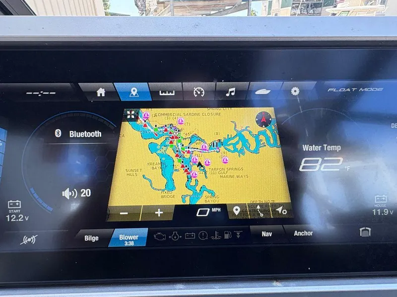Slide: The Image of Yamaha Boats 252SE 2021 dashboard displaying navigation map and water temperature at 82°F. - 12