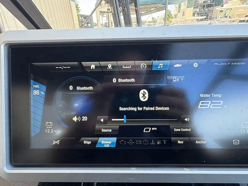 Slide: The Image of Dashboard of a 2021 Yamaha Boats 252SE showing Bluetooth and water temperature. - 13