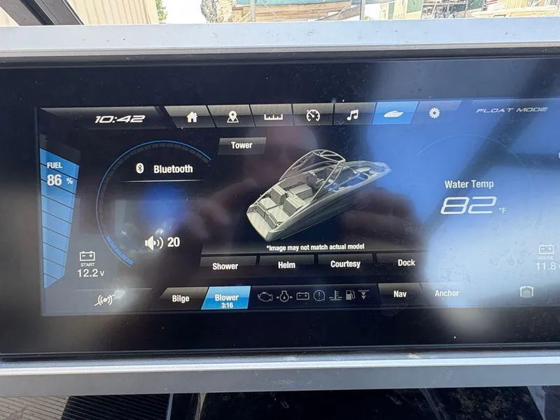 Slide: The Image of Dashboard of 2021 Yamaha Boats 252SE showing controls and water temperature. - 14