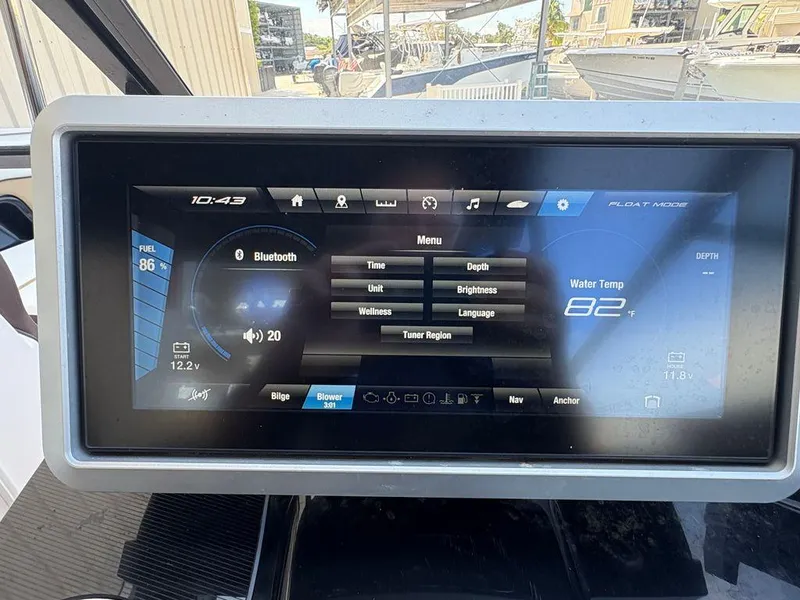 Slide: The Image of Yamaha Boats 252SE 2021 dashboard display showing fuel, Bluetooth, and water temperature. - 15