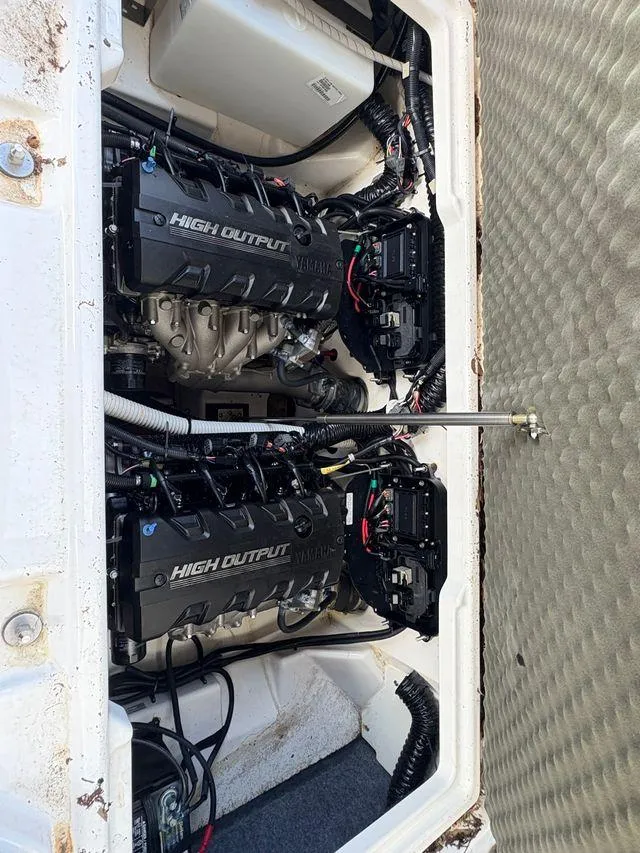 Slide: The Image of Engine compartment of a 2021 Yamaha Boats 252SE with high output engines. - 28