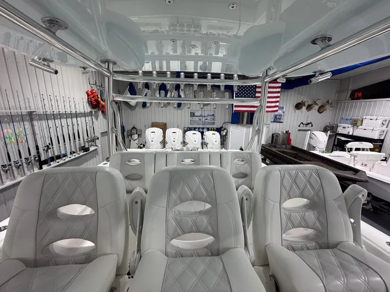Slide: The Image of 2024 Contender 44 ST boat interior with luxury seating and fishing gear. - 18