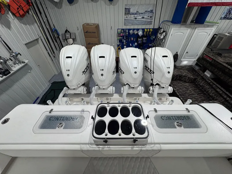 Slide: The Image of 2024 Contender 44 ST boat with four V8 engines in a well-equipped garage. - 24