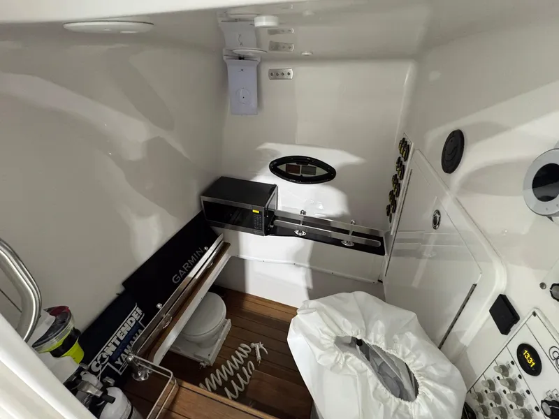 Slide: The Image of 2024 Contender 44 ST boat interior with modern amenities and wooden flooring. - 27