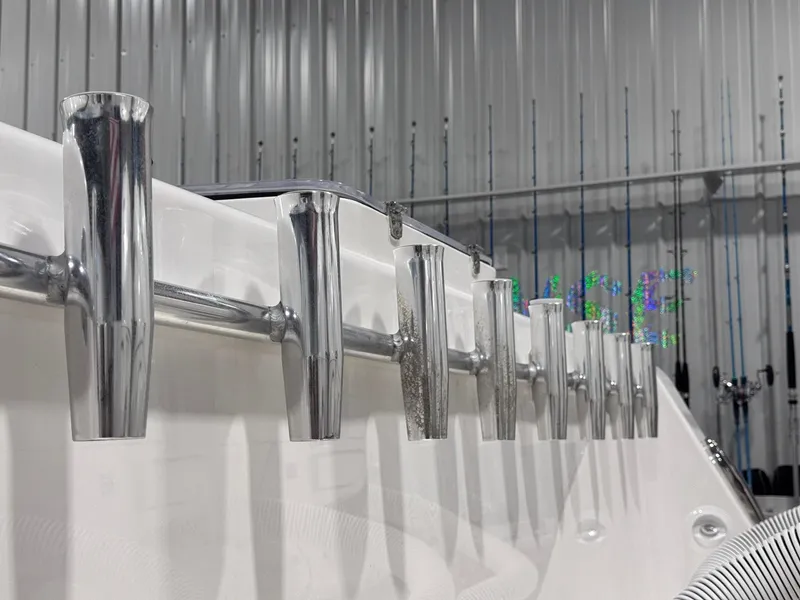 Slide: The Image of 2024 Contender 44 ST boat rod holders in a sleek, metallic finish. - 9