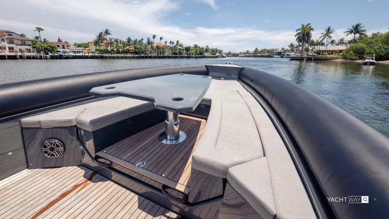 Slide: The Image of Luxurious 2025 Skipper-BSK 38NC yacht with spacious seating and table on a scenic waterway. - 22