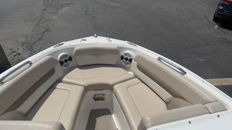 Slide: The Image of 2011 Chaparral 206 SSi boat interior with beige seating and speakers. - 14