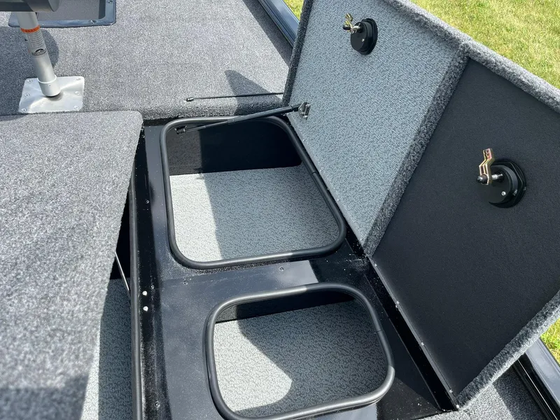 Slide: The Image of 2026 Lund 1875 Renegade SS boat storage compartments open, showcasing interior space. - 12