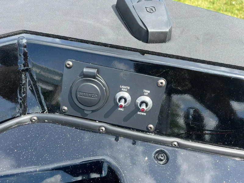 Slide: The Image of Control panel of 2026 Lund 1875 Renegade SS boat with switches and outlet. - 15