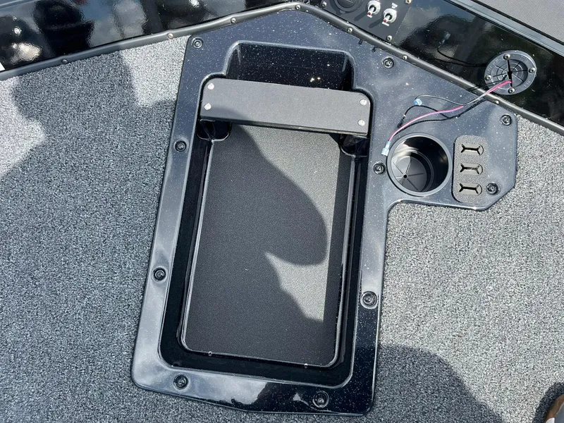 Slide: The Image of 2026 Lund 1875 Renegade SS boat deck with storage compartment and wiring details. - 16