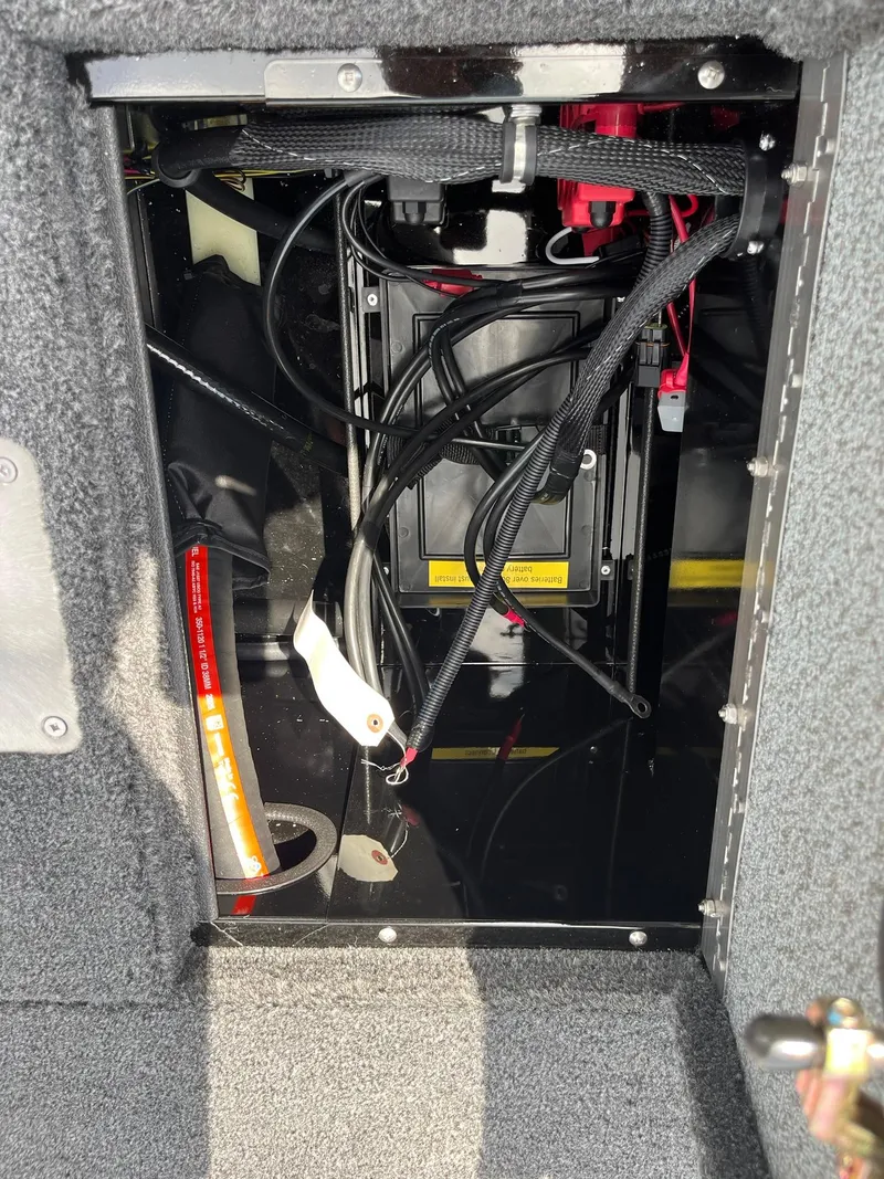 Slide: The Image of Interior view of 2026 Lund 1875 Renegade SS boat wiring and components. - 21