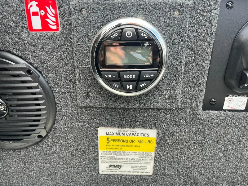 Slide: The Image of Control panel of 2026 Lund 1875 Renegade SS boat with speaker and capacity label. - 22
