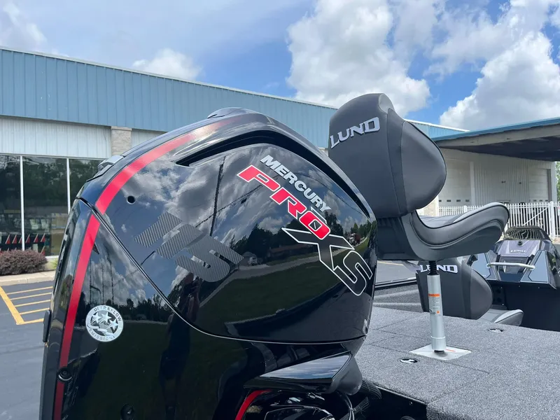 Slide: The Image of 2026 Lund 1875 Renegade SS boat with Mercury Pro XS engine, outdoor setting. - 4