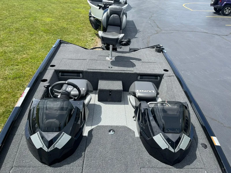 Slide: The Image of 2026 Lund 1875 Renegade SS boat interior with dual consoles and seating. - 7