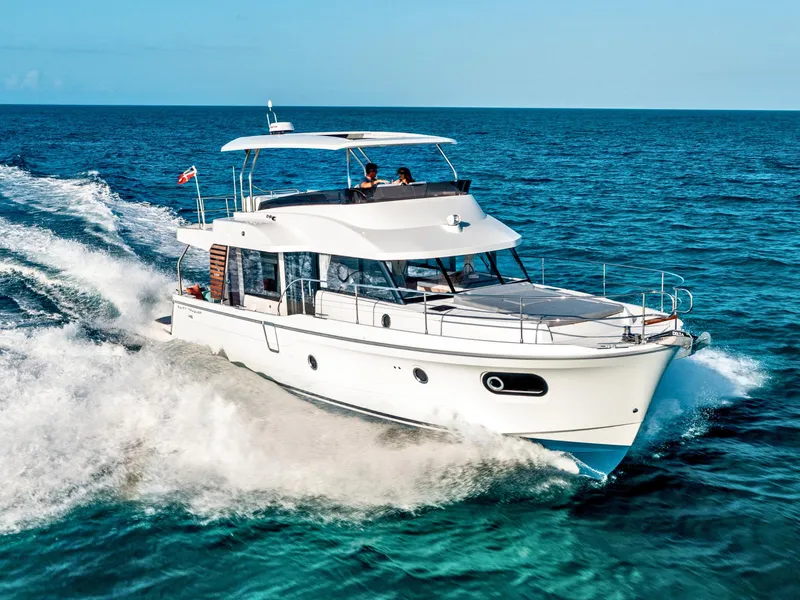 The Image of 2026 Beneteau Swift Trawler 48 cruising on open sea, showcasing sleek design and performance. - 0