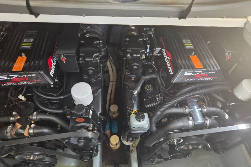 Slide: The Image of Twin MerCruiser 5.7L EFI engines in a 1998 Sea Ray 310 Sundancer boat. - 19