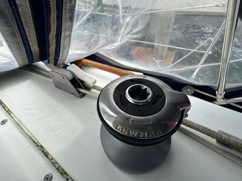 Slide: The Image of Winch on 1986 C&C 29 sailboat deck with clear canopy and ropes. - 10