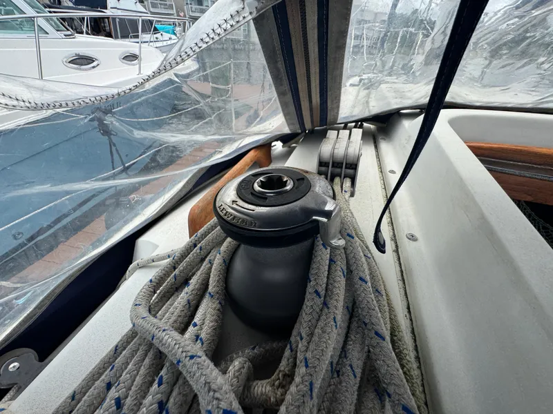 Slide: The Image of Winch and ropes on a 1986 C&C 29 sailboat deck, under a clear canopy. - 11