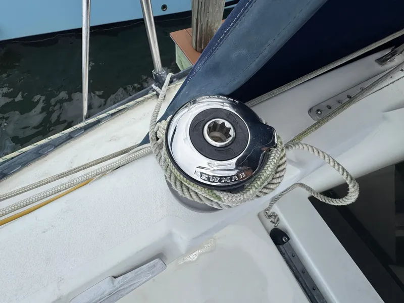 Slide: The Image of Winch on 1986 C&C 29 sailboat deck with coiled rope. - 12