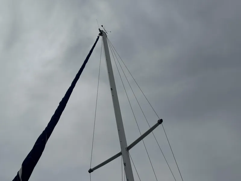 Slide: The Image of Mast of 1986 C&C 29 sailboat against cloudy sky. - 16