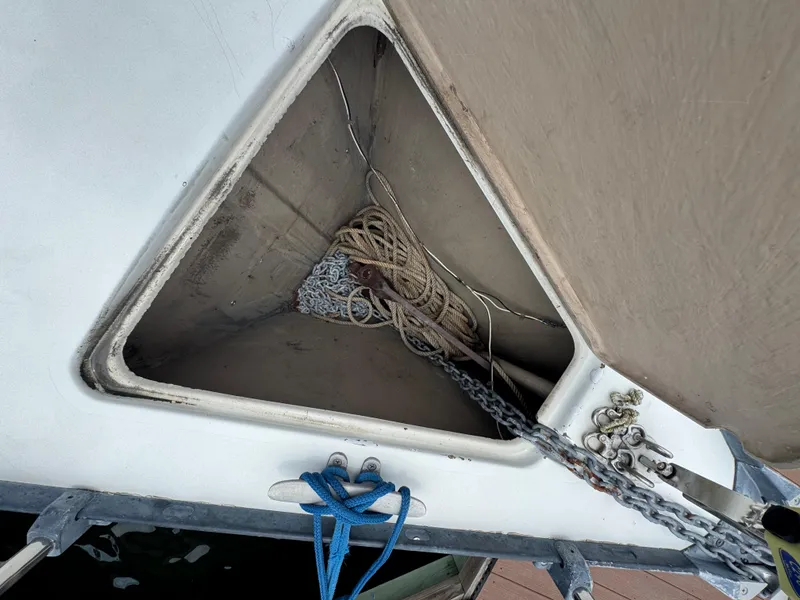 Slide: The Image of Anchor locker of a 1986 C&C 29 sailboat with ropes and chains. - 18