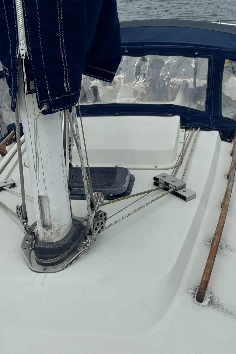 Slide: The Image of 1986 C&C 29 sailboat deck with rigging and covered mast. - 21