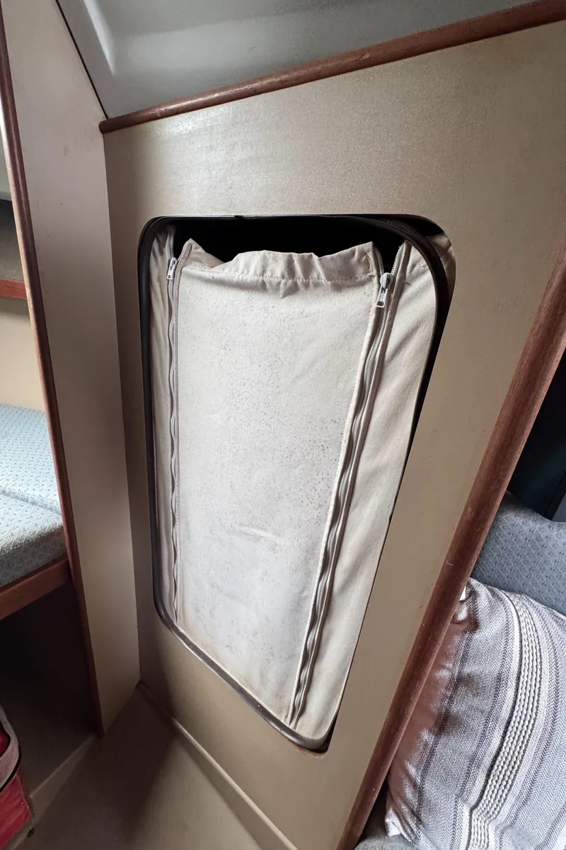 Slide: The Image of Interior of 1986 C&C 29 sailboat with fabric storage compartment. - 31