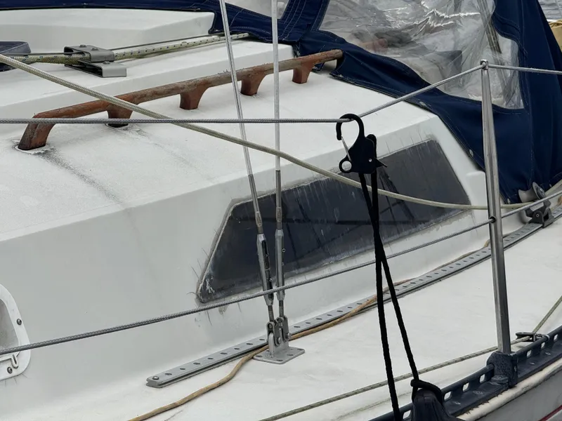 Slide: The Image of 1986 C&C 29 sailboat deck with rigging and window details. - 4
