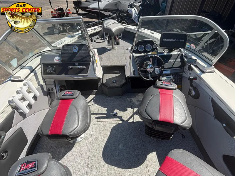 Slide: The Image of 2020 Ranger VX1888 WT boat interior with red and black seats, steering wheel, and Humminbird electronics. - 5