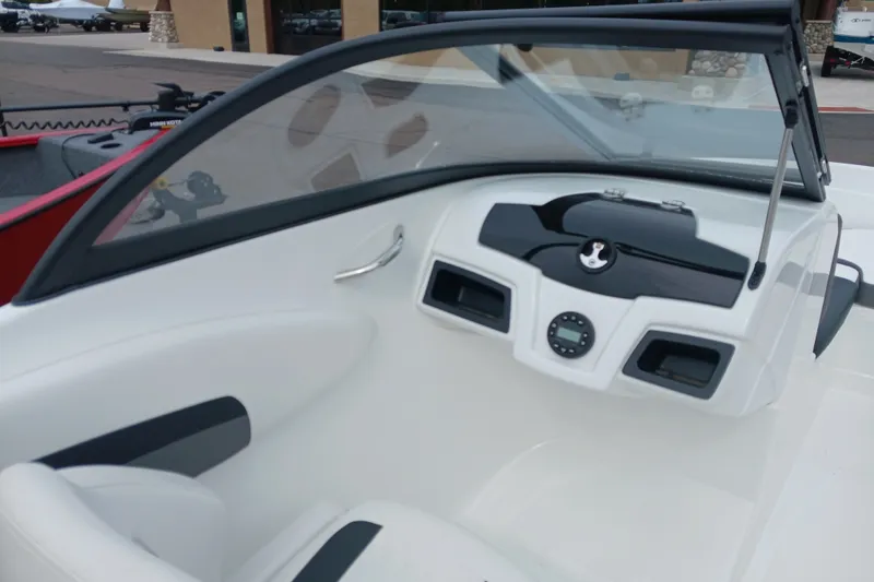 Slide: The Image of Interior view of a 2025 Tahoe 200 S boat dashboard with steering wheel and controls. - 8