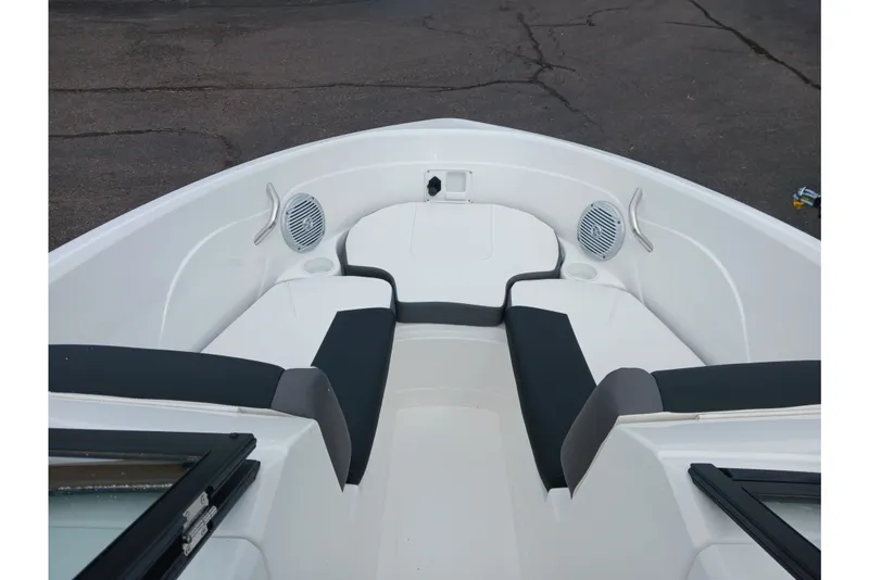 Slide: The Image of Bow seating area of 2025 Tahoe 200 S boat with speakers and cup holders. - 4