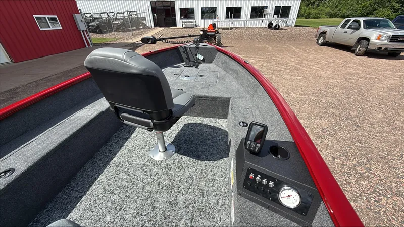 Slide: The Image of 2025 Tracker Super Guide V-16 T boat interior with seating and control panel. - 2