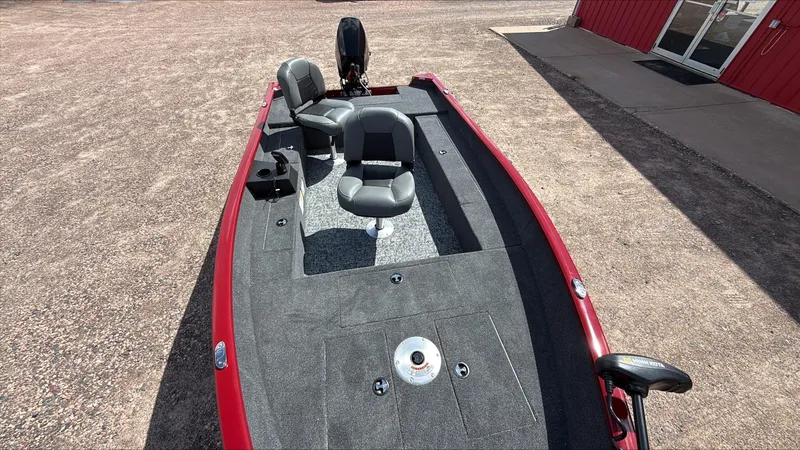 Slide: The Image of 2025 Tracker Super Guide V-16 T fishing boat with dual seats and red exterior. - 3