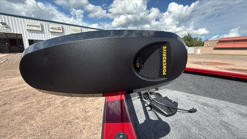 Slide: The Image of PowerDrive motor on 2025 Tracker Super Guide V-16 T boat, outdoor showroom background. - 4