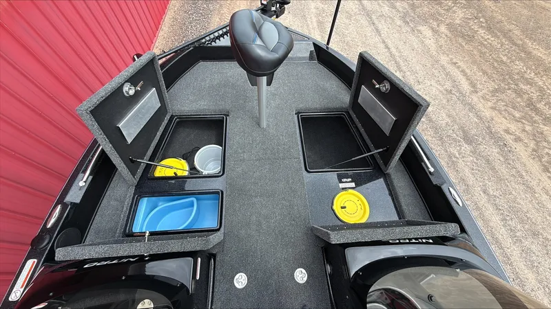 Slide: The Image of 2025 Nitro ZV19 boat interior with open storage compartments and seating. - 6