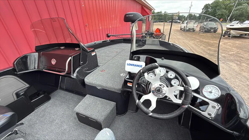 Slide: The Image of Interior of 2025 Nitro ZV19 boat with steering wheel and dashboard controls. - 7