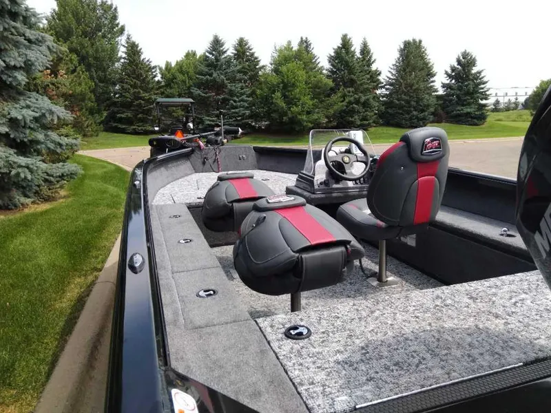 Slide: The Image of 2025 Ranger VS1665SC boat interior with dual seats and steering console. - 6