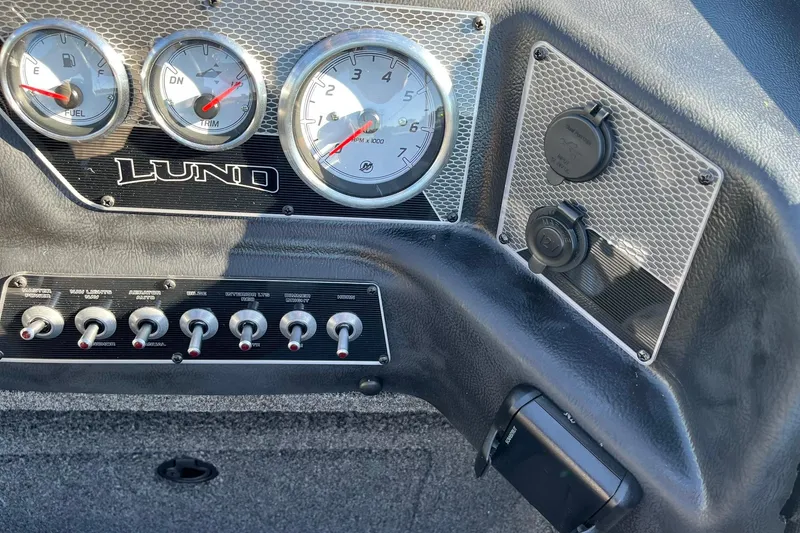 Slide: The Image of Dashboard of 2026 Lund 1875 Crossover XS boat with gauges and switches. - 25