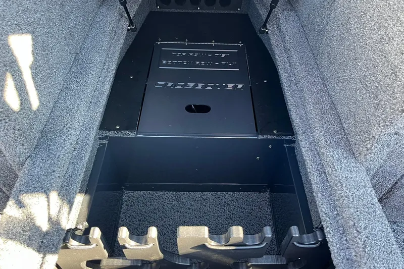 Slide: The Image of Interior view of 2026 Lund 1875 Crossover XS boat storage compartment. - 27