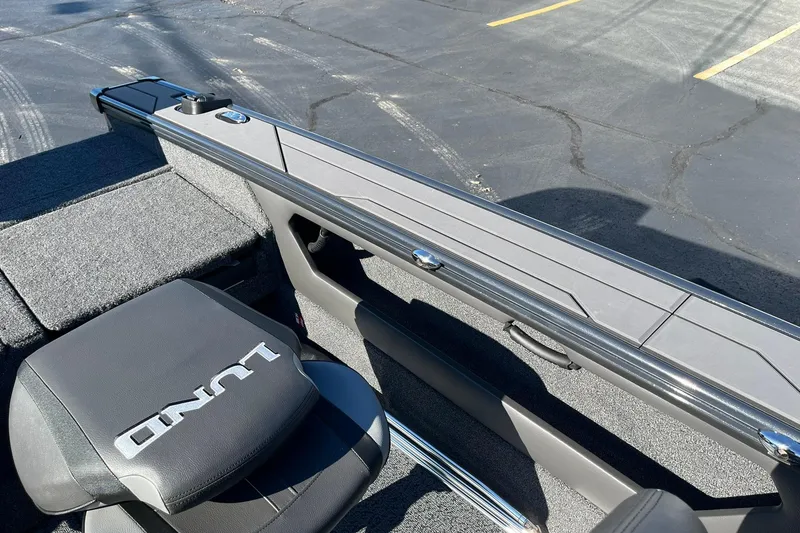 Slide: The Image of 2026 Lund 1875 Crossover XS boat interior with seating and storage compartments. - 30