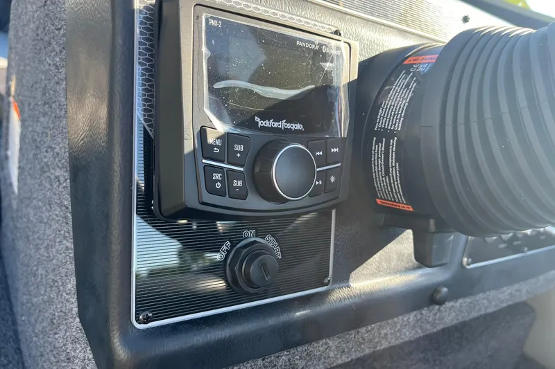 Slide: The Image of 2026 Lund 1875 Crossover XS dashboard with Rockford Fosgate audio system. - 33