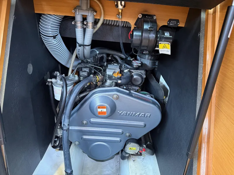 Slide: The Image of Engine compartment of a 2011 Jeanneau 409 sailboat, featuring a Yanmar engine. - 21
