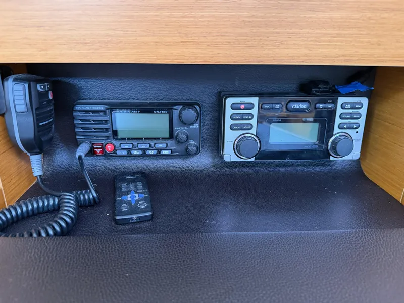 Slide: The Image of Radio and control panel inside a 2011 Jeanneau 409 sailboat cabin. - 22