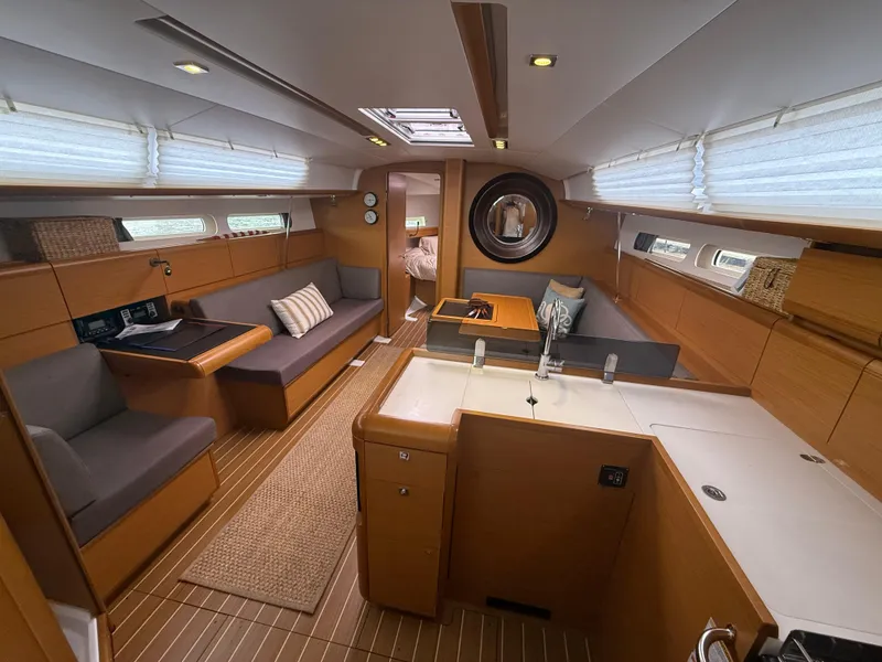 Slide: The Image of Luxurious interior of 2011 Jeanneau 409 sailboat with modern furnishings and ample natural light. - 9