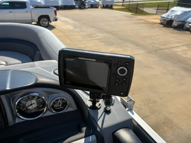 Slide: The Image of 2022 Trifecta CS 24RFC boat dashboard with Humminbird Helix 5 fish finder. - 10
