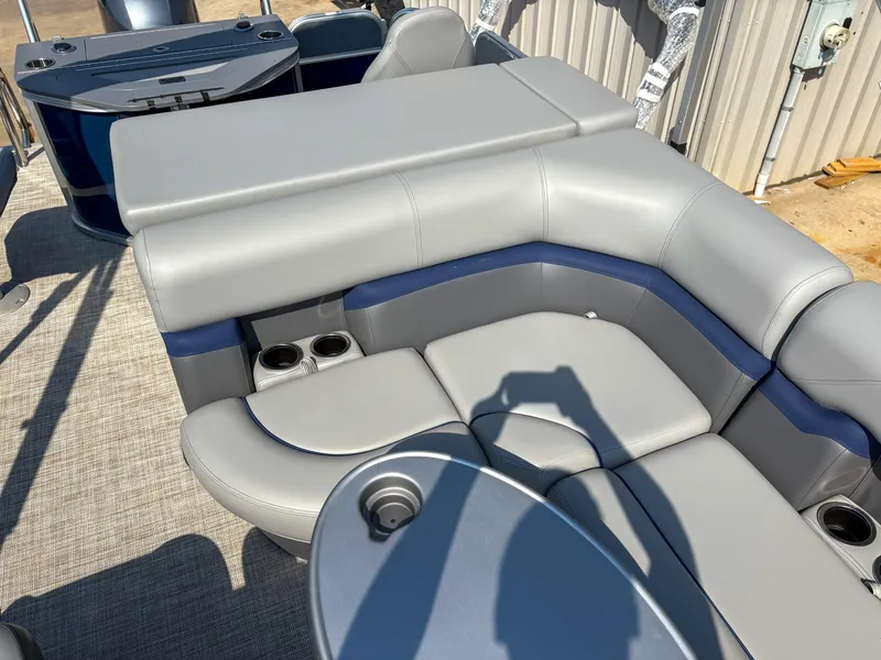 Slide: The Image of 2022 Trifecta CS 24RFC boat interior with gray seating and cup holders. - 13