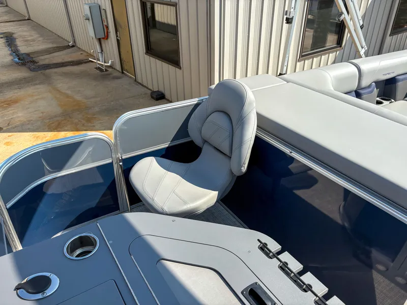 Slide: The Image of 2022 Trifecta CS 24RFC boat interior with gray seating and cup holder. - 5