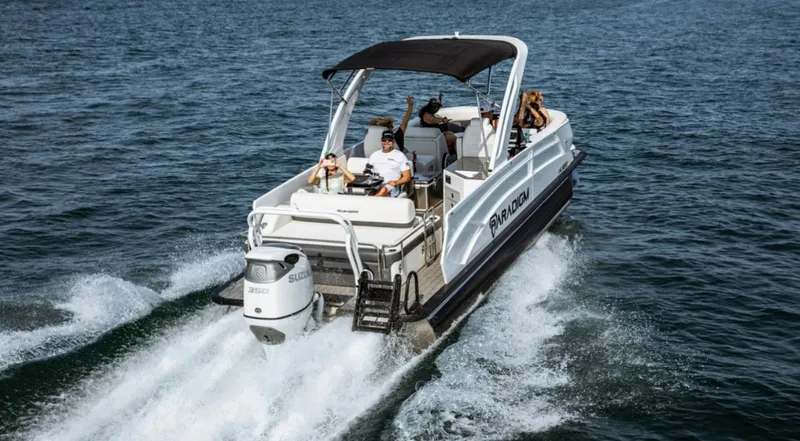 Slide: The Image of 2024 Paradigm 27SS boat cruising on open water with passengers enjoying the ride. - 3