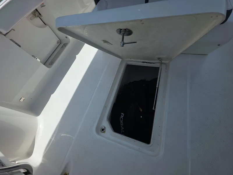 Slide: The Image of Open storage compartment on 2021 Robalo R272 Center Console boat. - 13